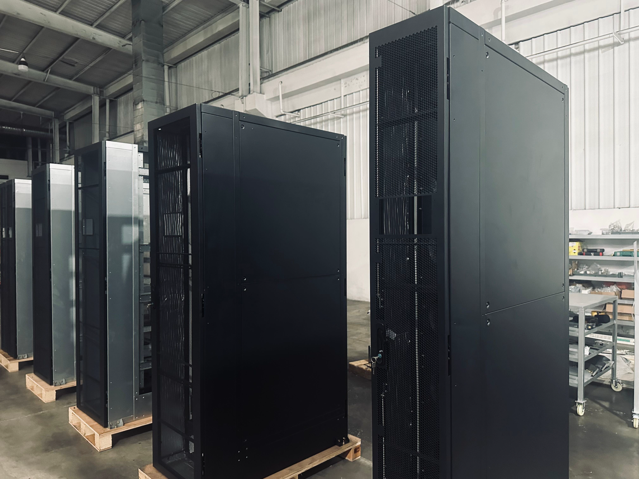 Cooling equipment cabinets in a manufacturing environment